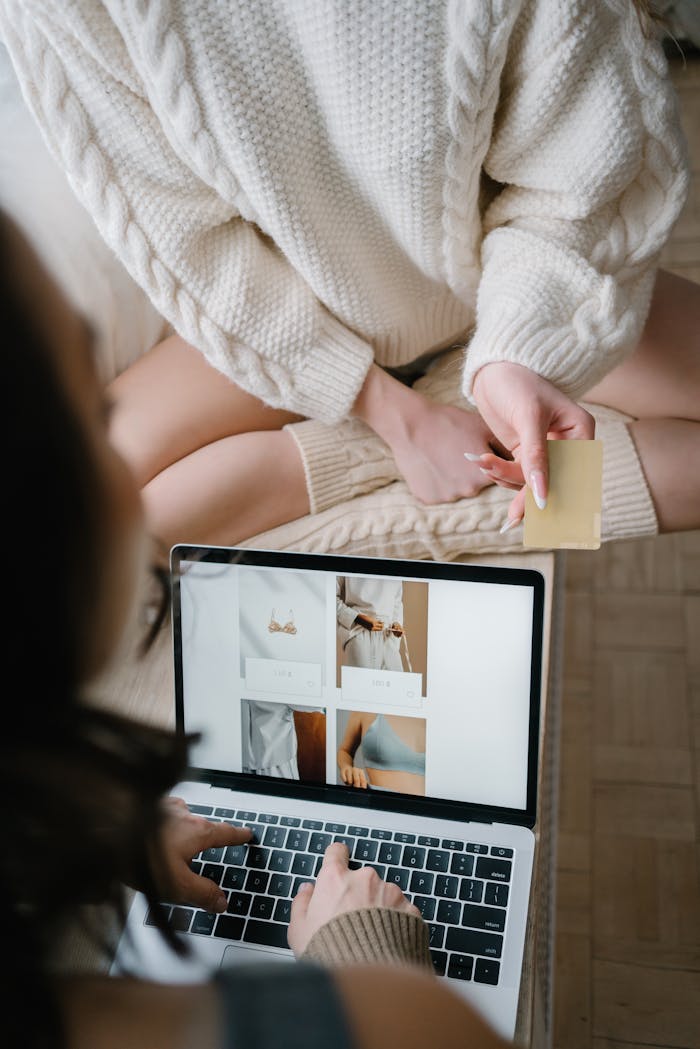 Two people using a laptop for online shopping, highlighting modern e-commerce trends.